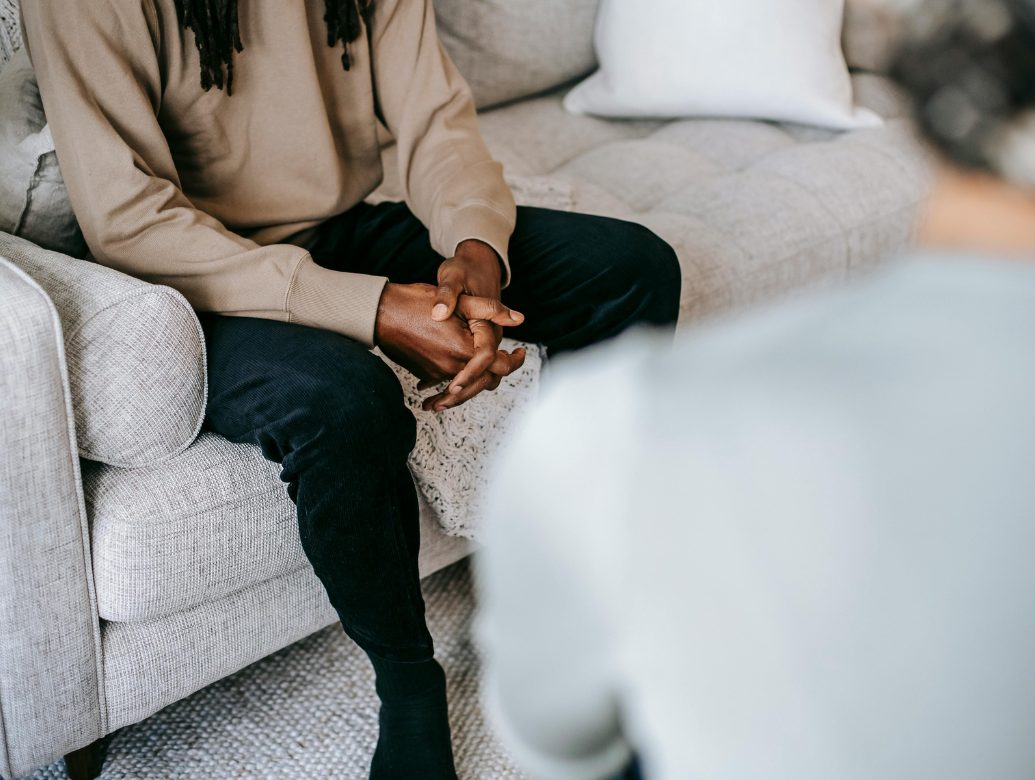 A therapist guiding a client through CBT techniques