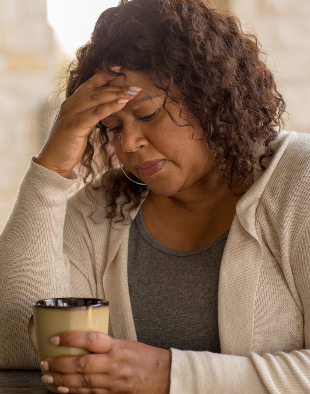 A person in a calm telehealth therapy session at home