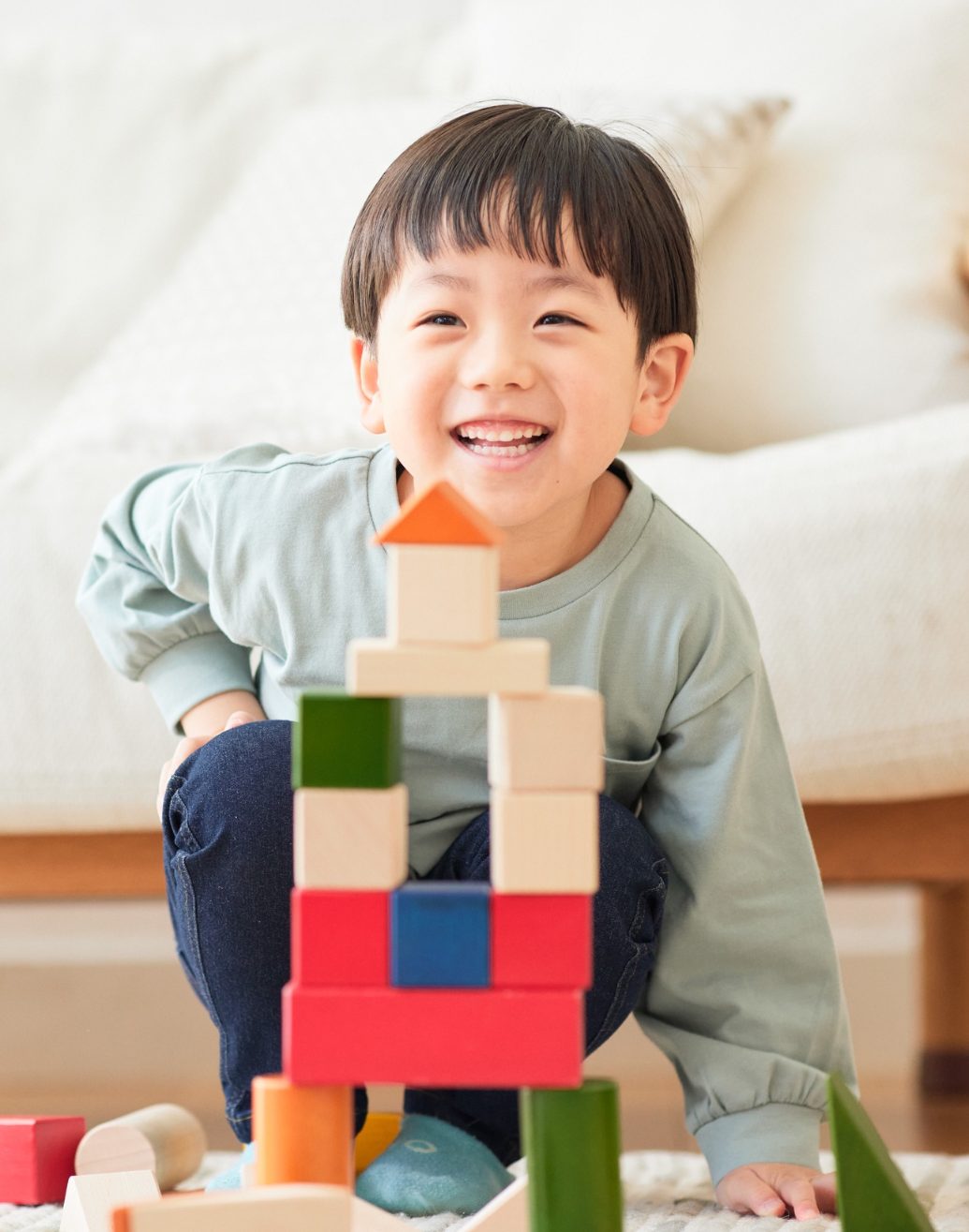 A child in a comforting telehealth therapy session at home