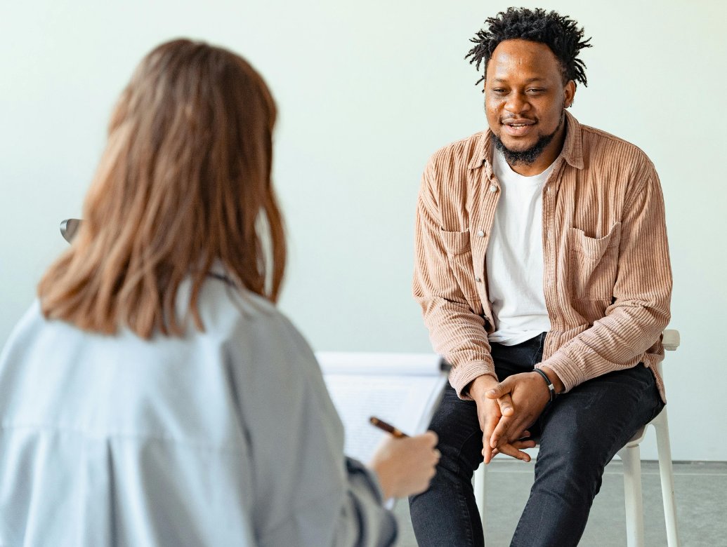 A client in a supportive conversation with their therapist