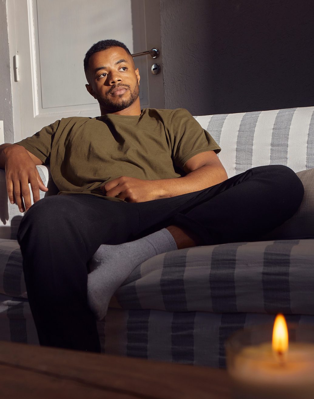 A person in a calm, private telehealth therapy session at home